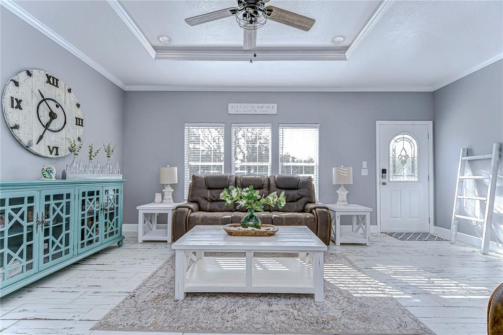 Neutral paint, trayed ceilings and bathed in natural light!