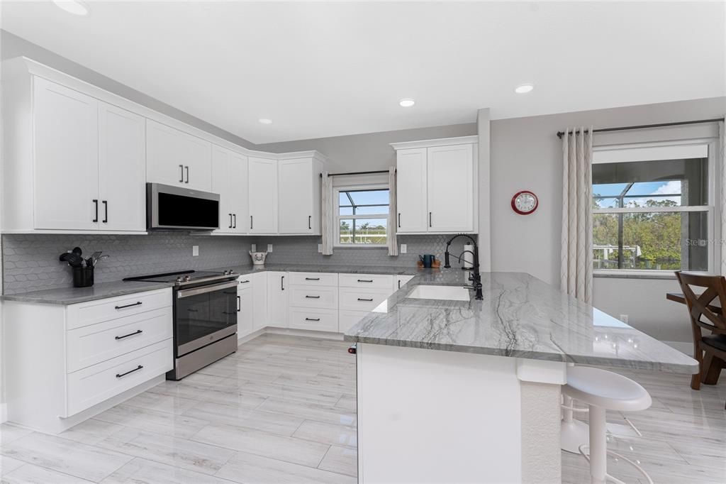 Custom built wood cabinetry topped with Quartzite countertops!