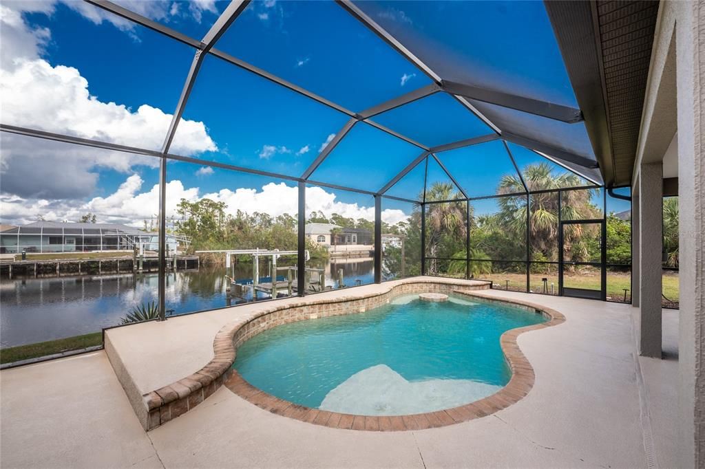 Pretty pool and waterfront beyond.