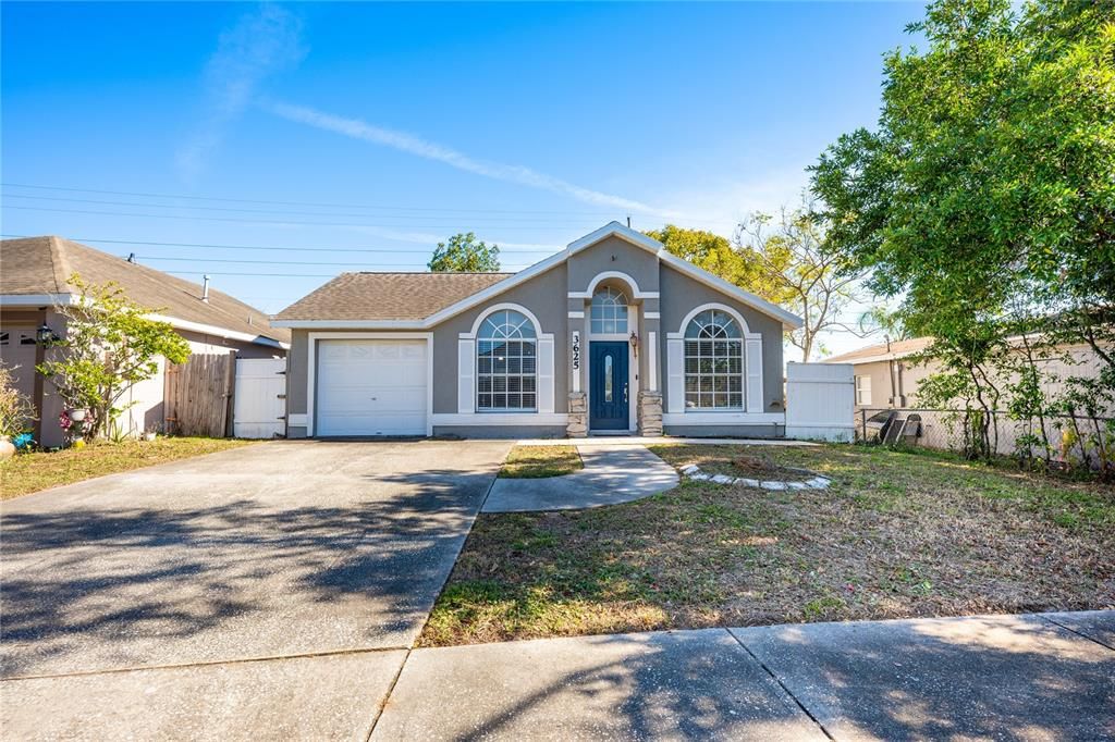 Welcome to East Orlando’s Pine Ridge Hollow community and this 3BD/2BA block home with UPDATES throughout, WOOD LOOK TILE FLOORS for easy maintenance, light and bright OPEN CONCEPT LIVING, flex space and a newer roof!