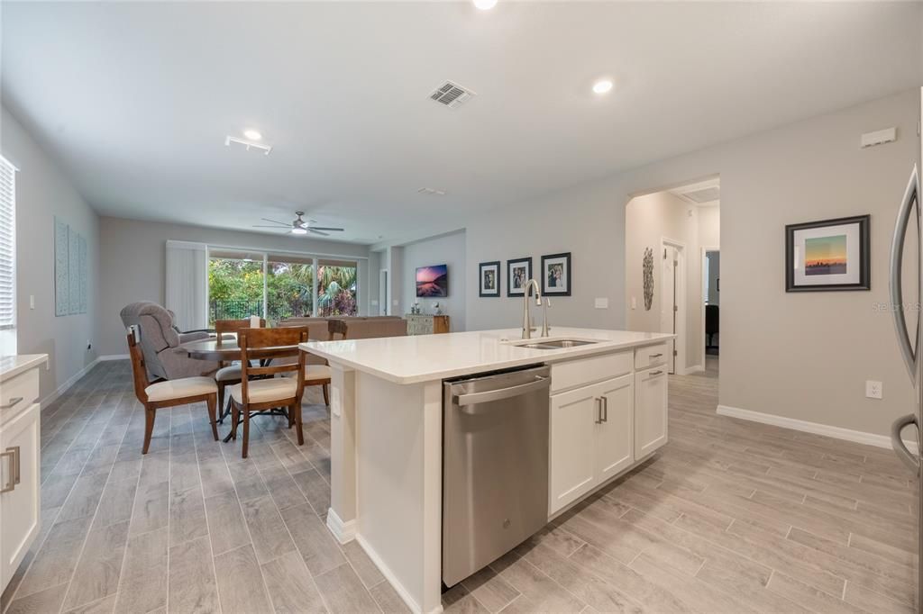 The kitchen opens to the dining and family room.