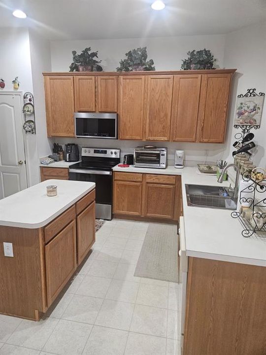 The kitchen is somewhat of a U shape with an island in the middle.  the island has electical connection so you have plenty of workspace while working in the kitchen.