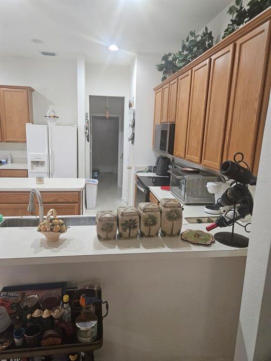 From the breakfast bar looking straight ahead is the entrance to the three-car garage.