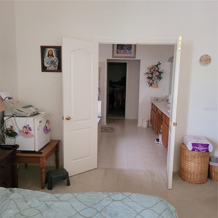 This view is from the primary bedroom towards the private bathroom.  On the right hand side, you will have the double hand basin  and the left is the tub with a separate shower.