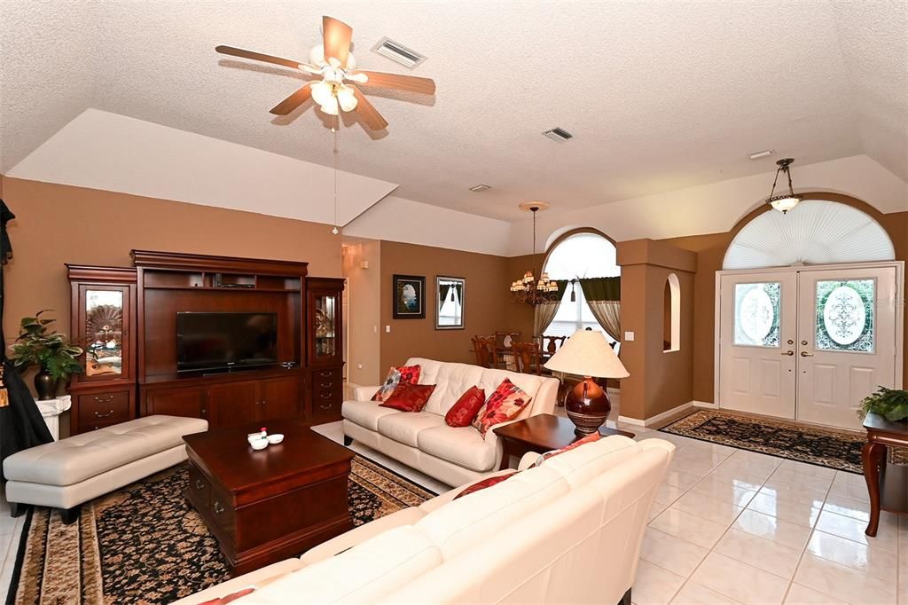 Living Room with view to front door and dining room