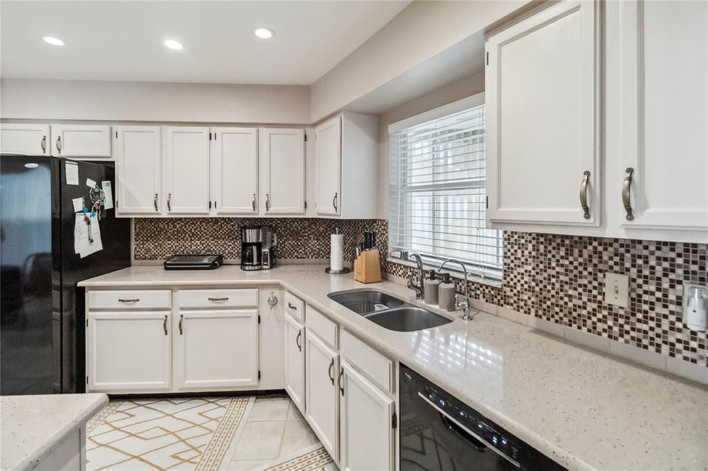 Beautiful renovated kitchen has water filtration system under sink.