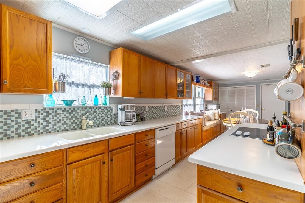 large updated kitchen with Corian countertops