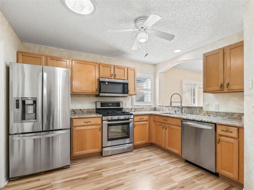 Kitchen with gas range and Stainless steel appliances