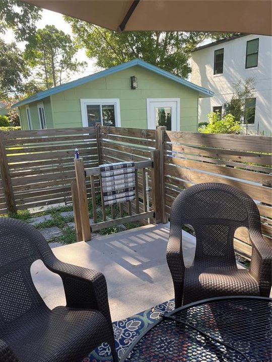 Concrete patio, studio in back