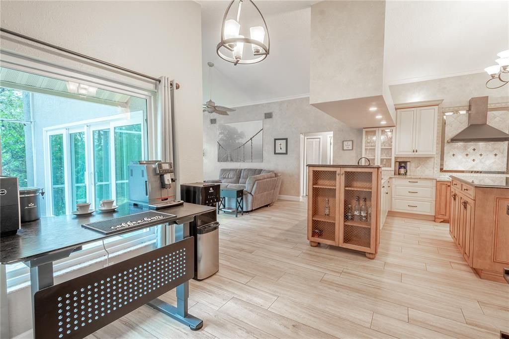 There's a charming breakfast nook with a three bulb pendant light, and picture window.