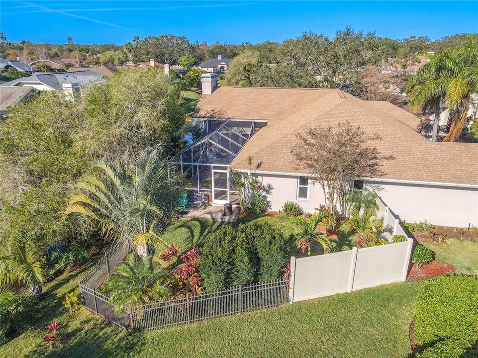 Mature landscaping and fenced in backyard.