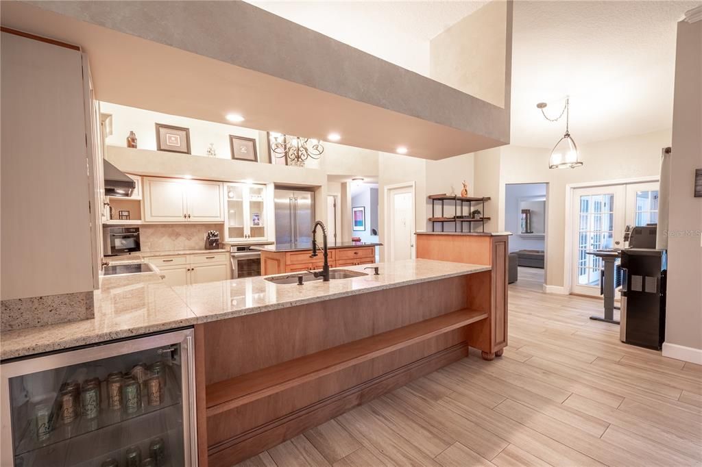 The kitchen has a built-in beverage cooler.