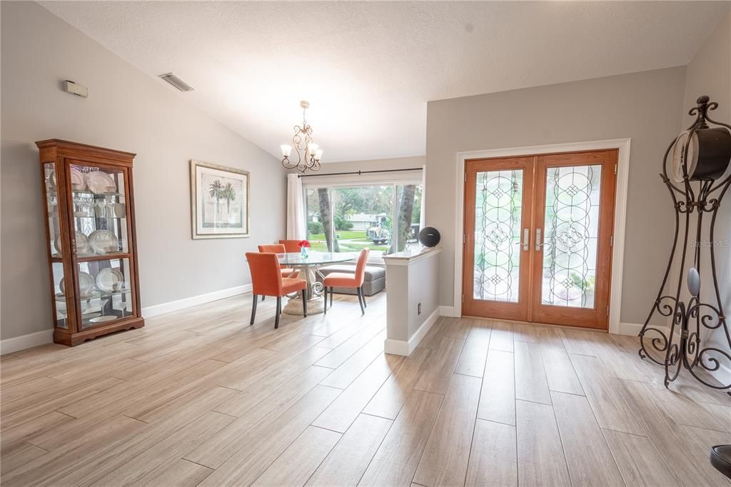 Neutral tones and easy to maintain, wood-like porcelain tile throughout the home.