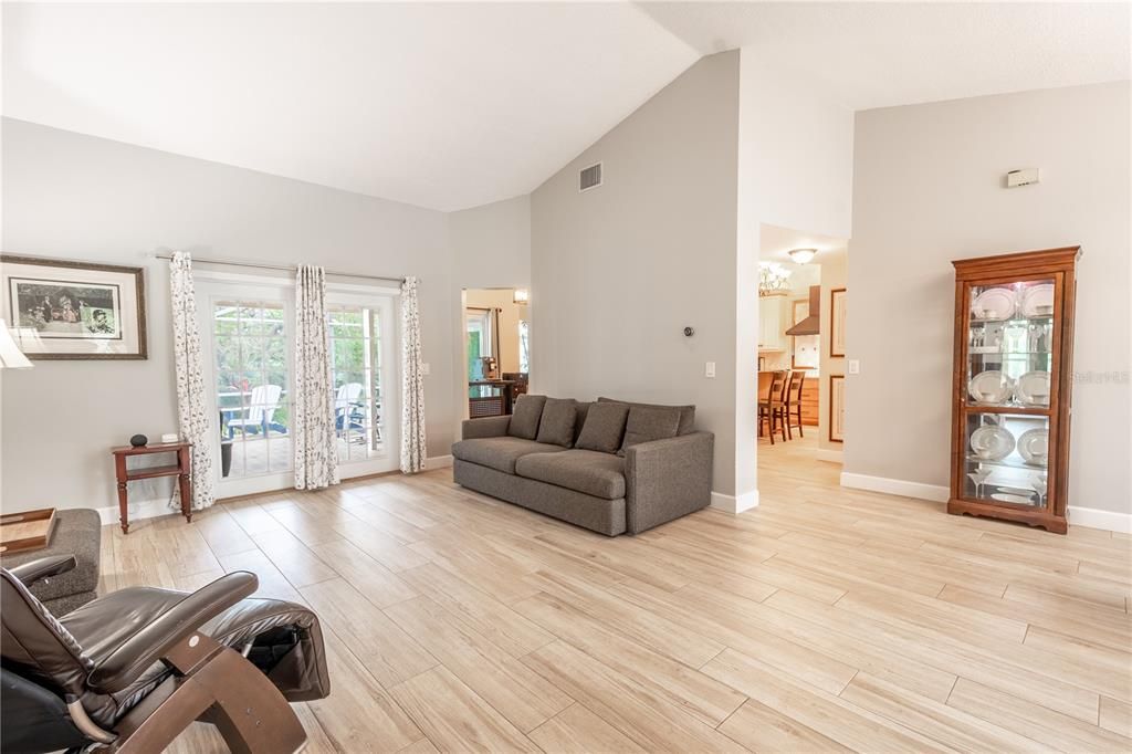 The living room is open to the kitchen and dining room.