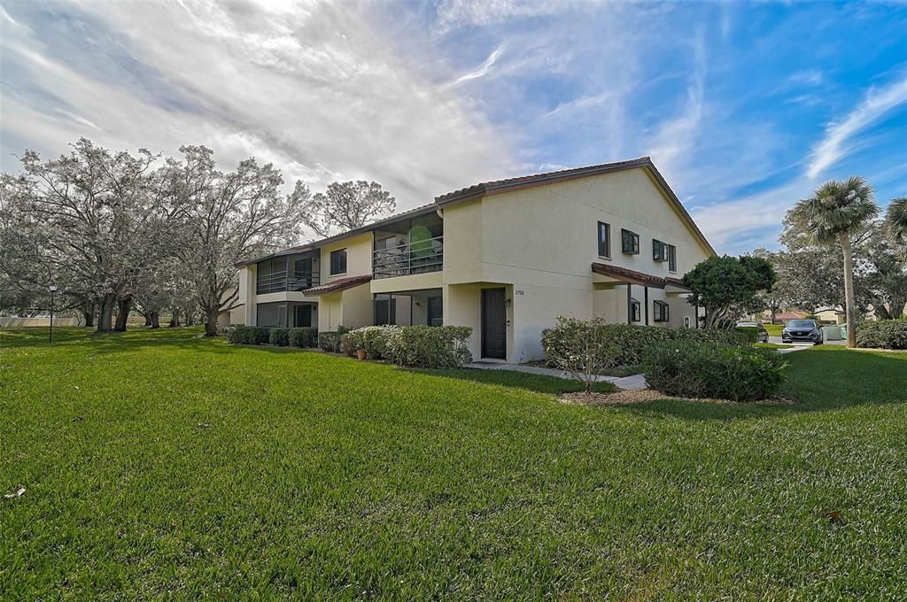 The way this condo is situated on the grounds provides a large expanse of grassy privacy, offering a peaceful and serene setting.