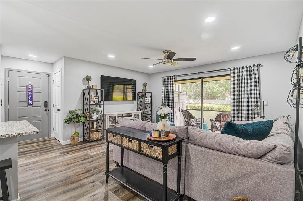 Canned lighting, skipped trowel ceilings, and modern light fixtures brighten and open up this inviting space!