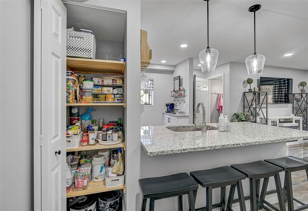 Every inch of space is thoughtfully utilized in this full remodel, including the addition of a convenient pantry!