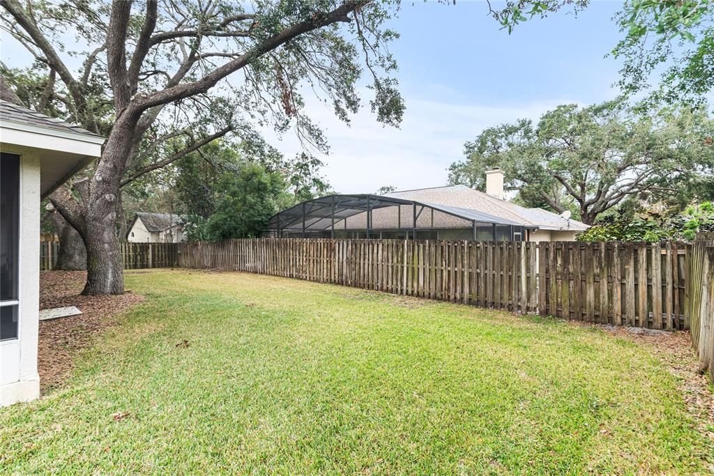 Fully fenced in back yard provides plenty of space for outdoor play.