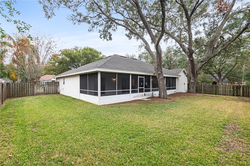 Fully fenced in back yard provides plenty of space for outdoor play.