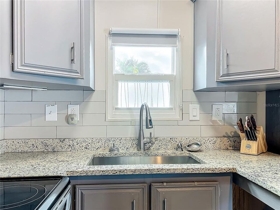 Close up of the kitchen and faucet.