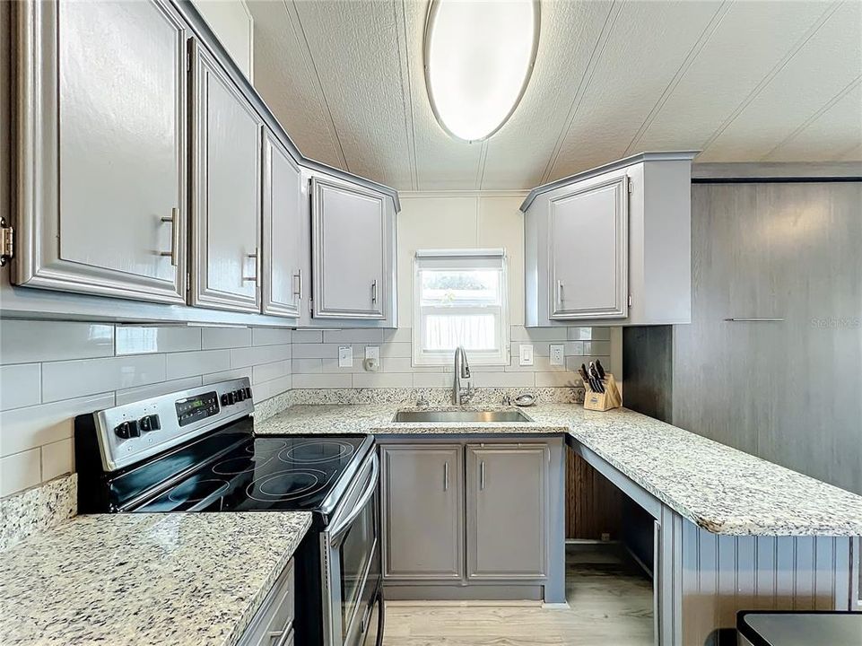 Subway tile complements the finishes of this beautifully renovated kitchen.