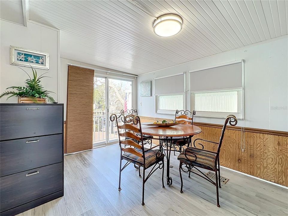 Dining room with sliding door leading to the Trex deck and view of the waterfront.