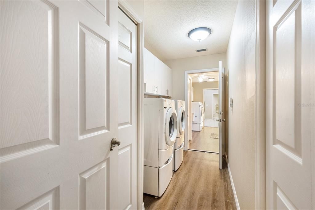 Primary Residence Laundry room, Garage Access and leads to Secondary Residence