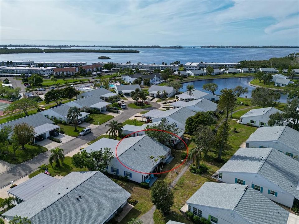 Sarasota Bay seen in background and the clubhouse and amenities just across the street