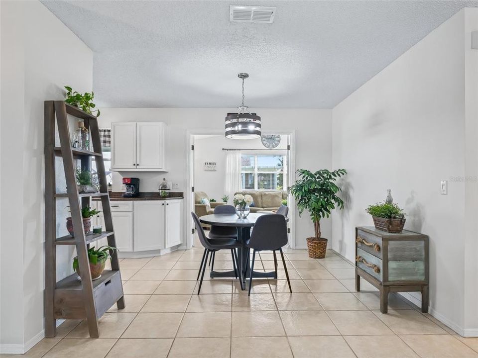 One dining area with another on other side of kitchen.