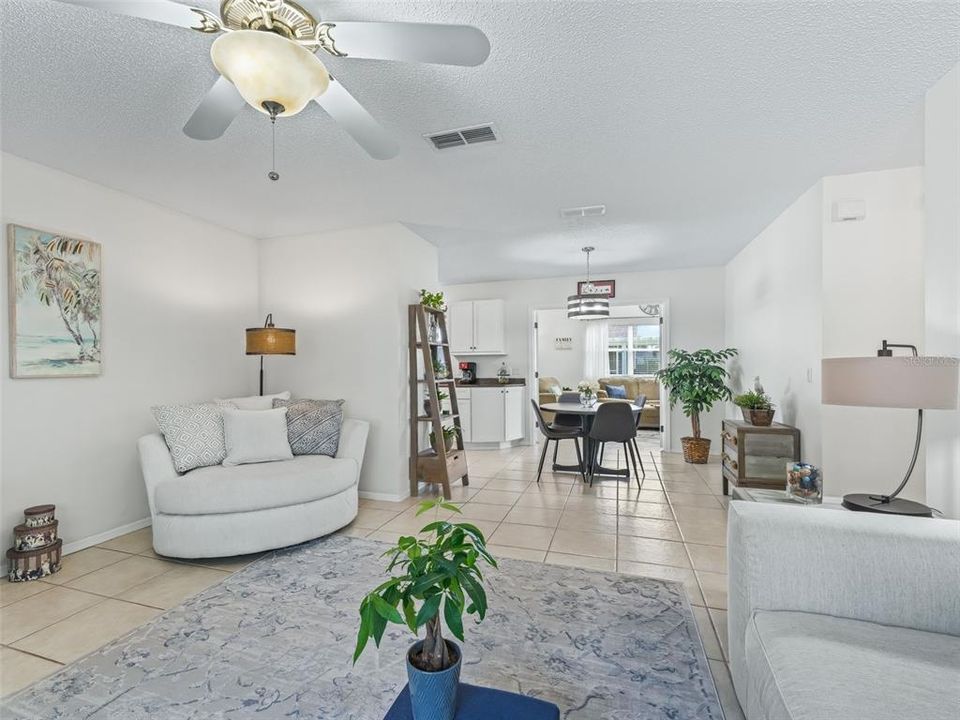 From great room to dining area, with French Doors to BONUS ROOM.