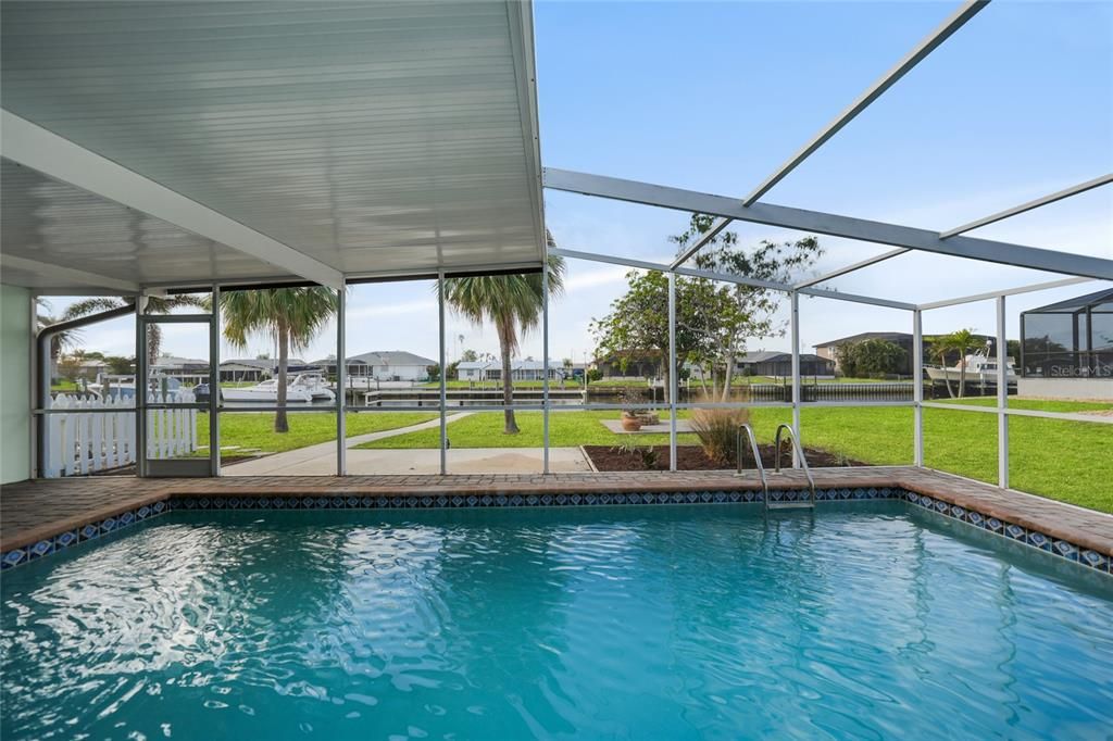 Heated, In-ground Pool with Pavers and Large Area Under Truss