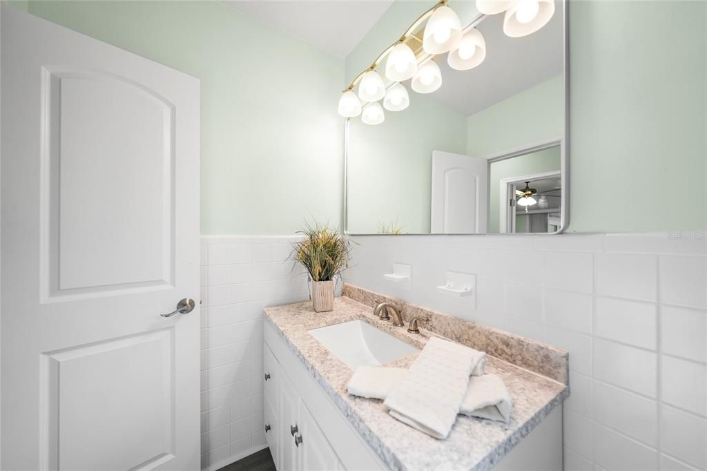 Main Bath with New Vanity and Countertop, New Mirror and Lighting