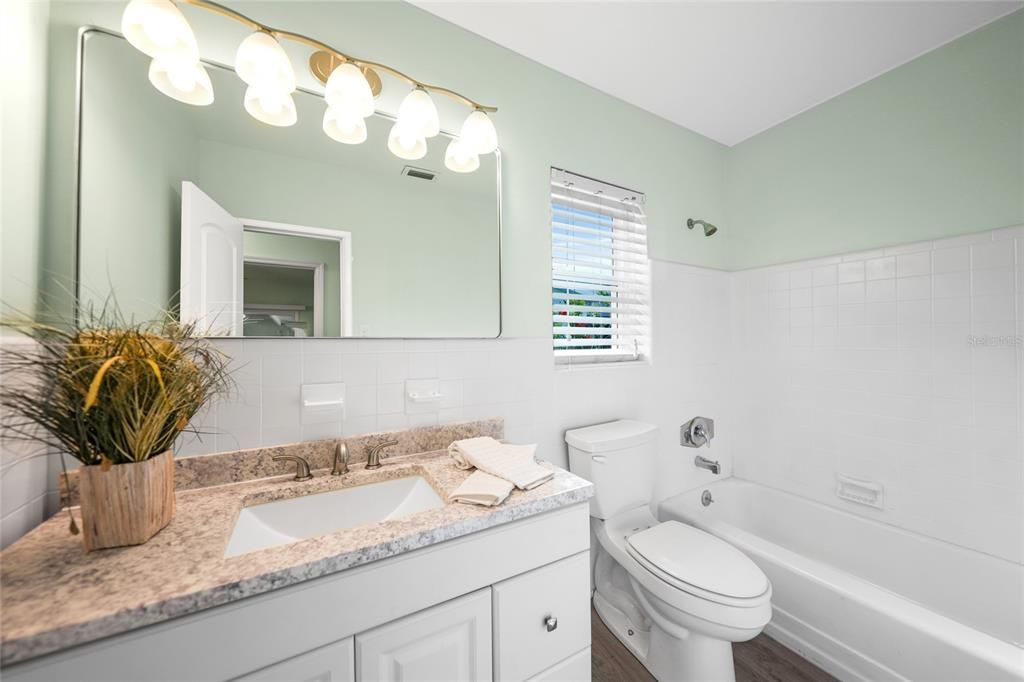 Main Bath with New Vanity and Countertop, New Mirror and Lighting