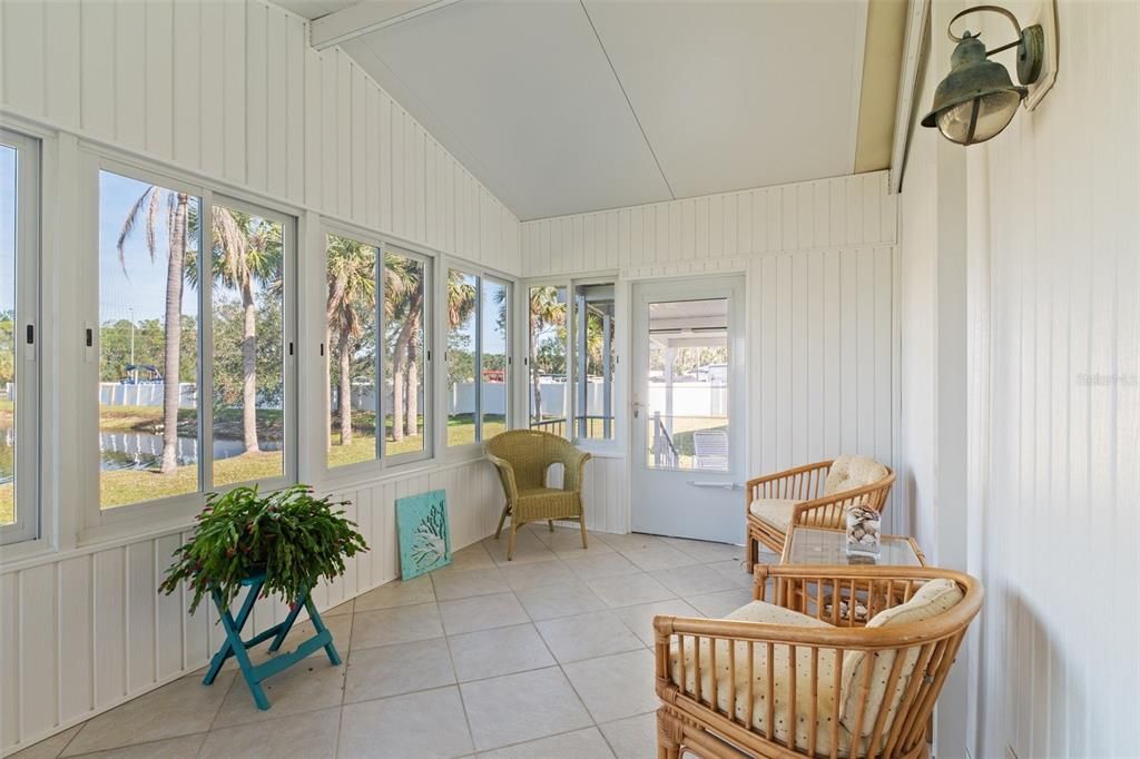 Entering the Florida room from either the living area sliders or the back entrance door.