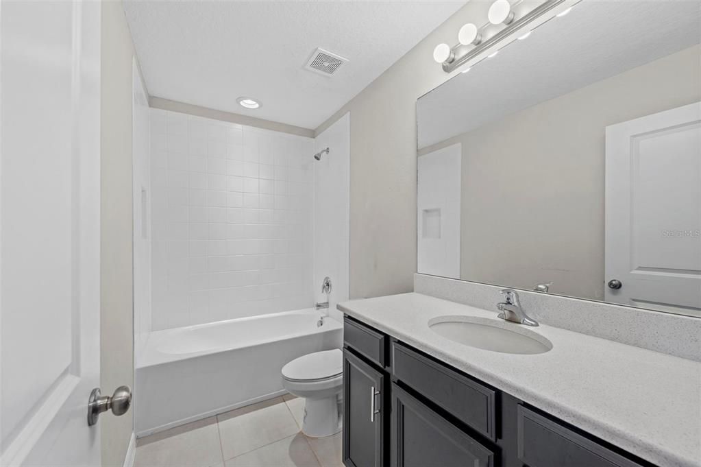 Upstairs bathroom with shower/tub