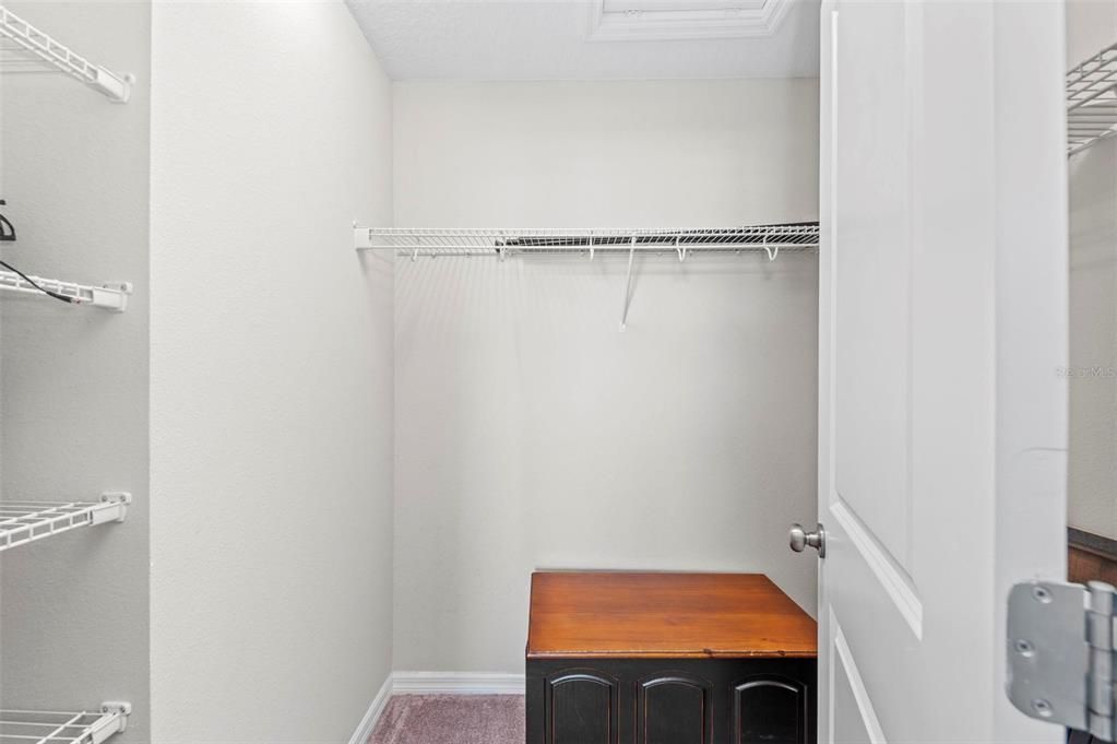 Walk in closet in primary bedroom