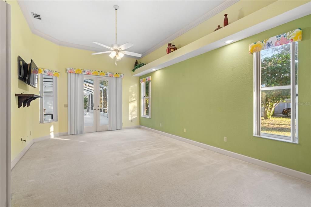 Master bedroom, French doors open to the pool.