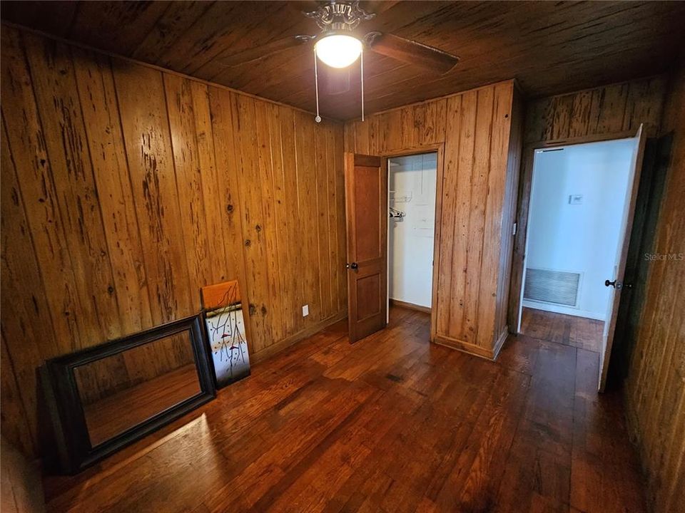 Bedroom #2 w/Knotty Cypress Wood Paneling.