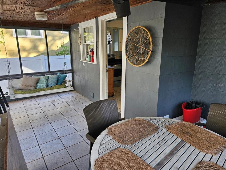 Rear Screened Porch Off of Kitchen w/ Knotty Cypress Ceilings.