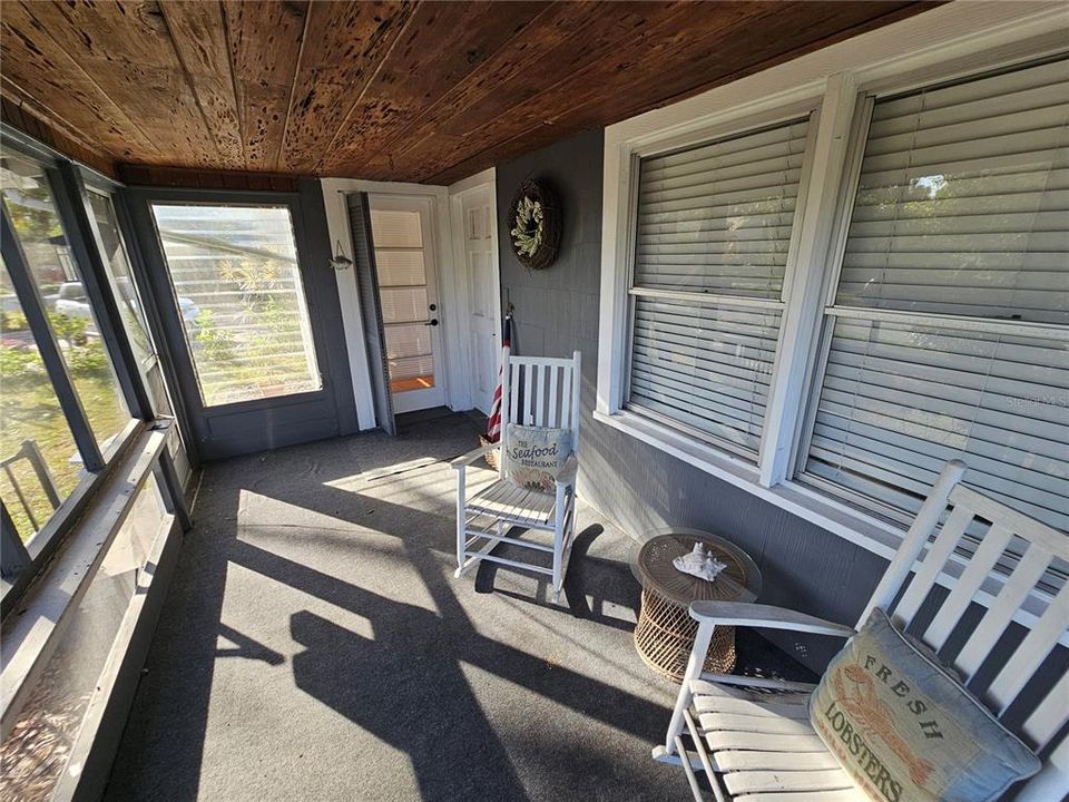 Screened front Porch w/ Access to Living Room & Primary Bedroom.