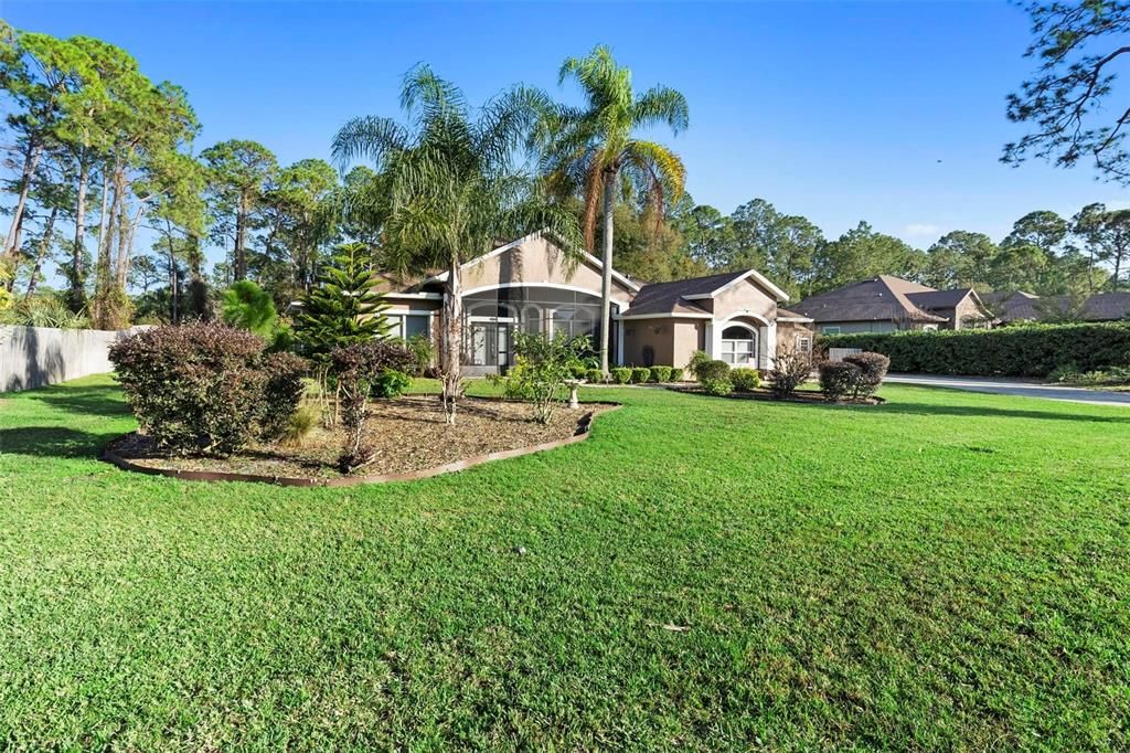 This estate home sits on nearly 1/2 acre in the country, just a short distance from everything.