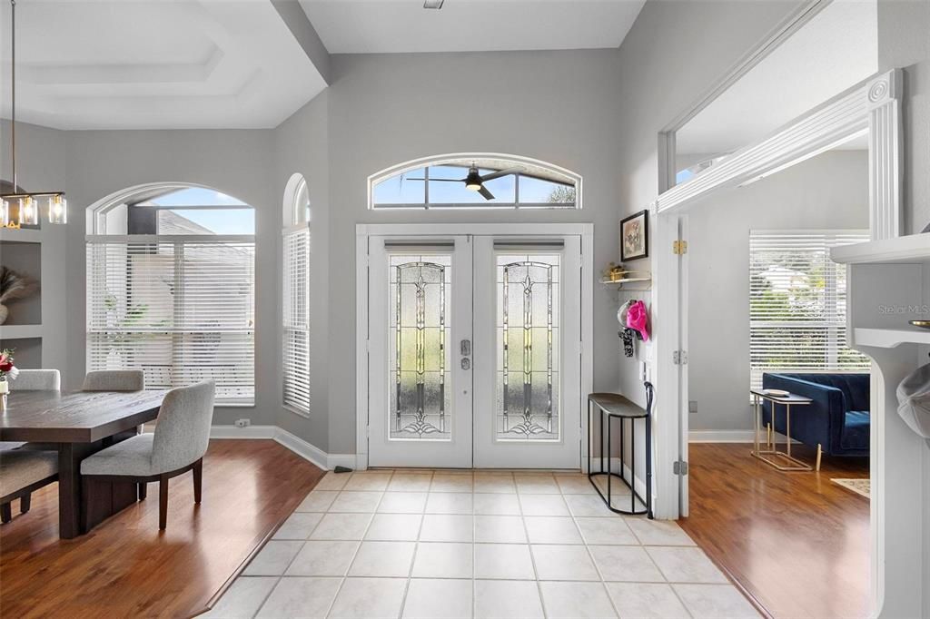 Front entrance. Formal dining area at left. Bonus room with French doors at right.