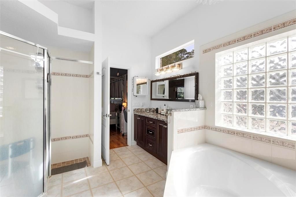 Ensuite bath features a walk-in shower (at left).