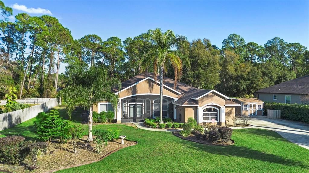 4/2 pool home on nearly 1/2 acre less than a mile from the St. Johns River.