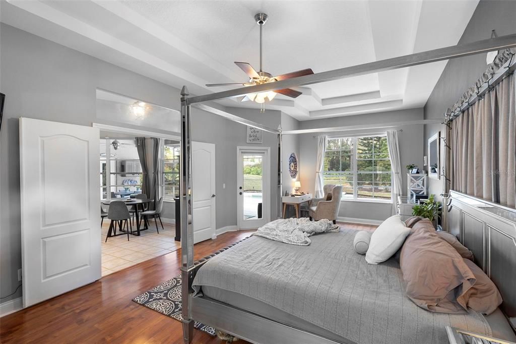 Primary bedroom suite. Kitchen, pool/lanai entrance, views of pool area (left to right).