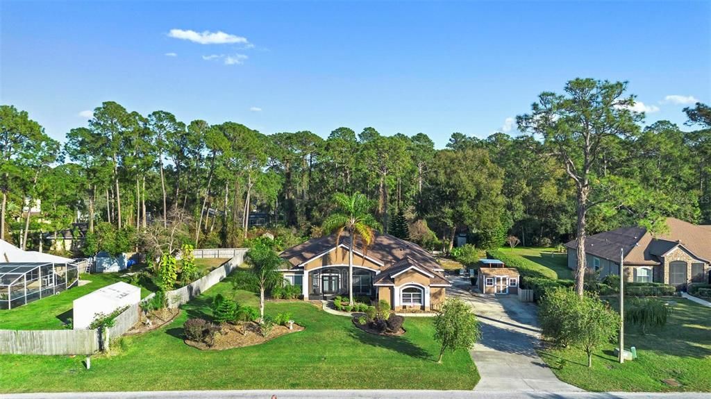 This home sits amidst a sparsely populated neighborhood of estate homes.