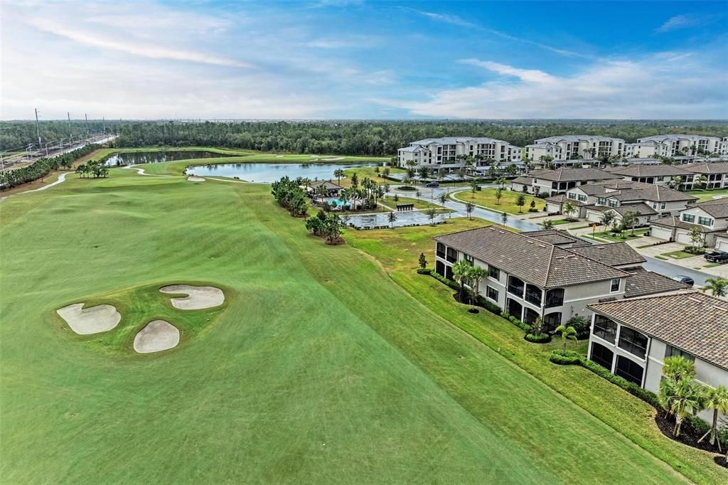 Aerial view of golf course behind the property to the mailbox and a pool that's close if you don't want to go to the Amenity Center Pool