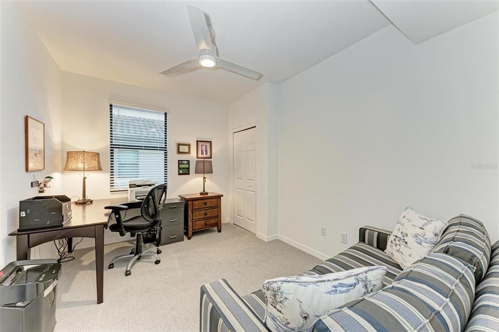 Bedroom 2 has new carpet, a new fan, custom shelves in the closet and this room can also be used as a home office or craft room