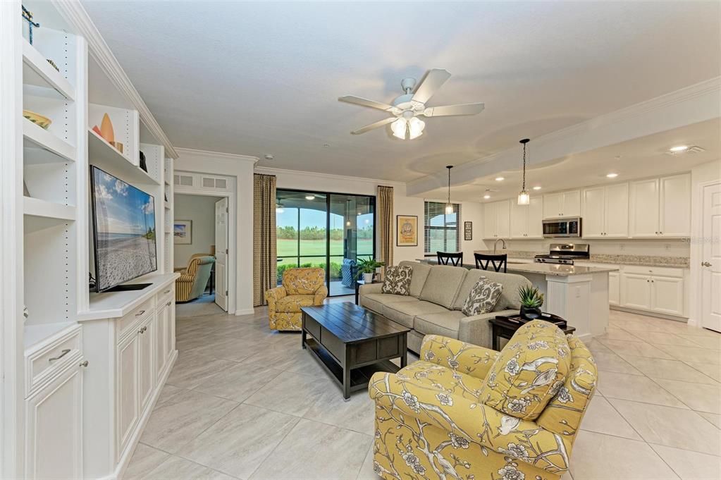 View from the Dining Room to the beautiful Kitchen and Golf course beyond the lanai