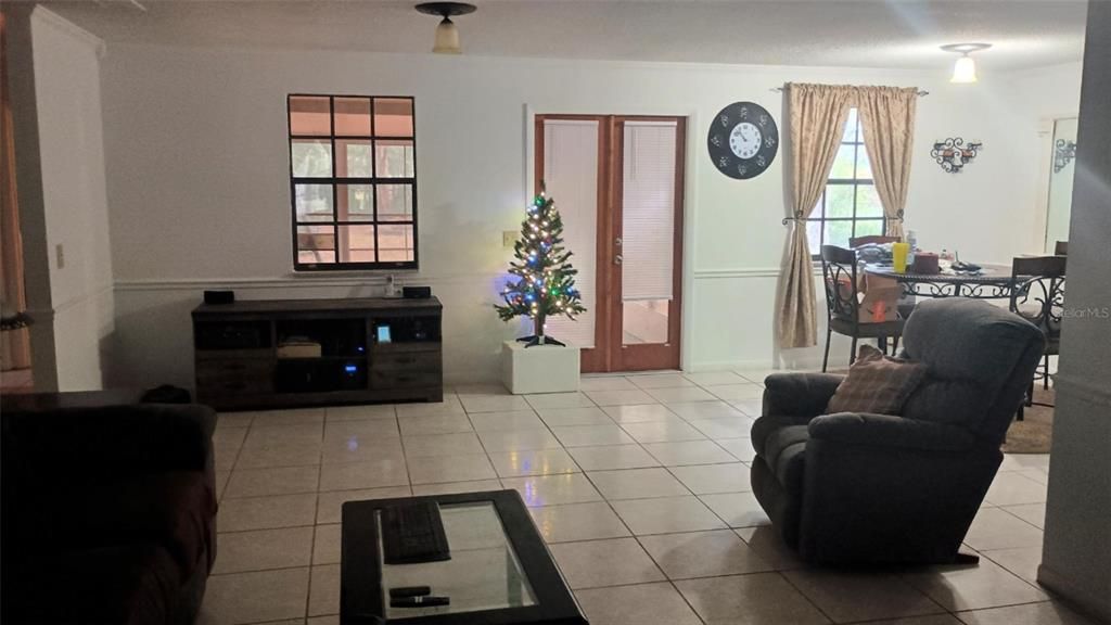 Main living area towards screened rear porch.